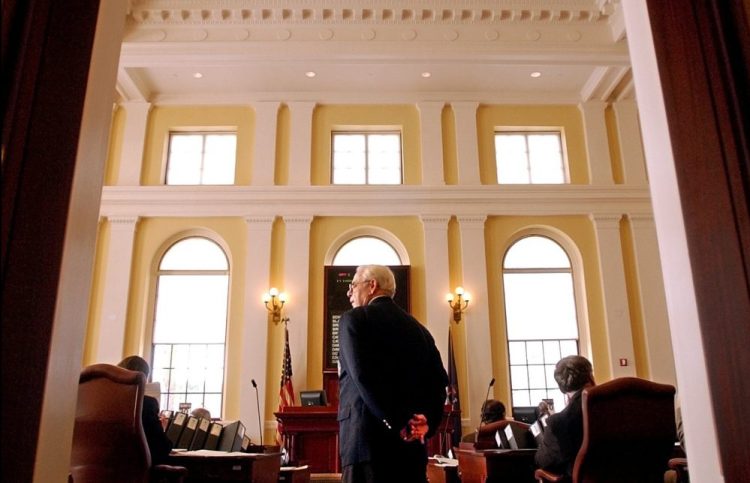 Robert Crockett watches over proceedings at the State House in Augusta in 2004, when he served as the Maine Senate's sergeant-at-arms.