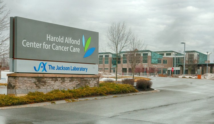 The Jackson Laboratory's name has been added to the sign, seen Wednesday, at the Harold Alfond Center for Cancer Care in Augusta.