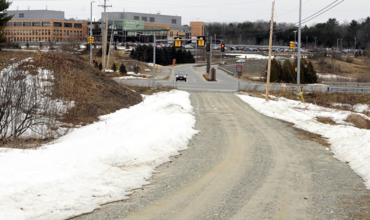 This photo taken Friday shows Henrys Way in the foreground and MaineGeneral Medical Center in the background in north Augusta. Henrys Way is an unpaved road across Old Belgrade Road from the hospital campus.