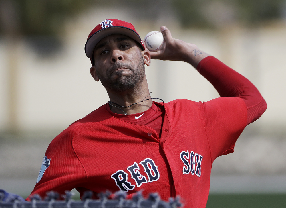 Boston Red Sox pitcher David Price throws a live batting session at a spring training baseball workout last month in Fort Myers, Florida. Price is likely to start the season on the disabled list because of his sore pitching elbow. Starting the second season of a $217 million, seven-year contract, Price has not yet appeared in an exhibition game.