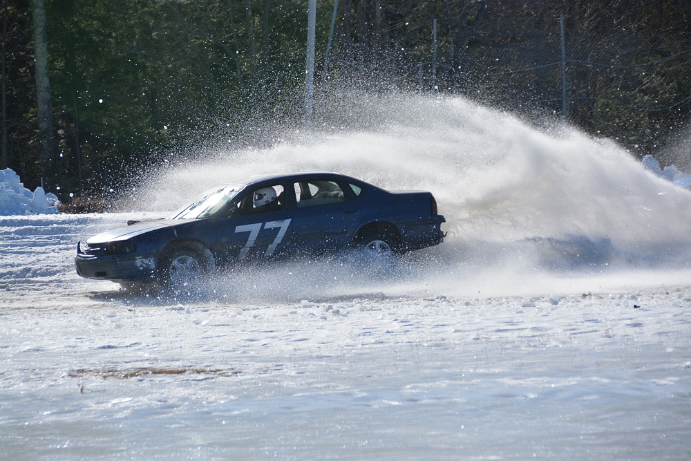 A car blasts its way through some snow during the Snowbowl Enduro 100 at Unity Raceway on March 5