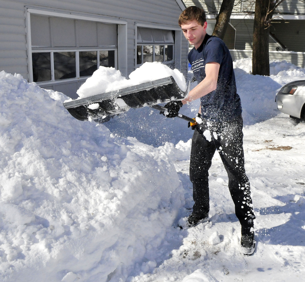 Kyle Howard needed to wear only a T-shirt while shoveling snow Wednesday. "It got so warm today I took off my coat," Howard said.