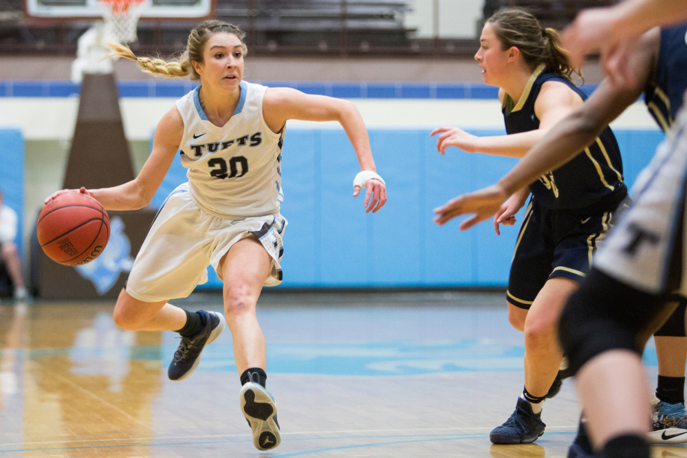 Tufts guard and Cony graduate Josie Lee (20) brings the ball up the court during a game against Trinity College back in February. The Jumbos defeated the Bantams, 74-39.
