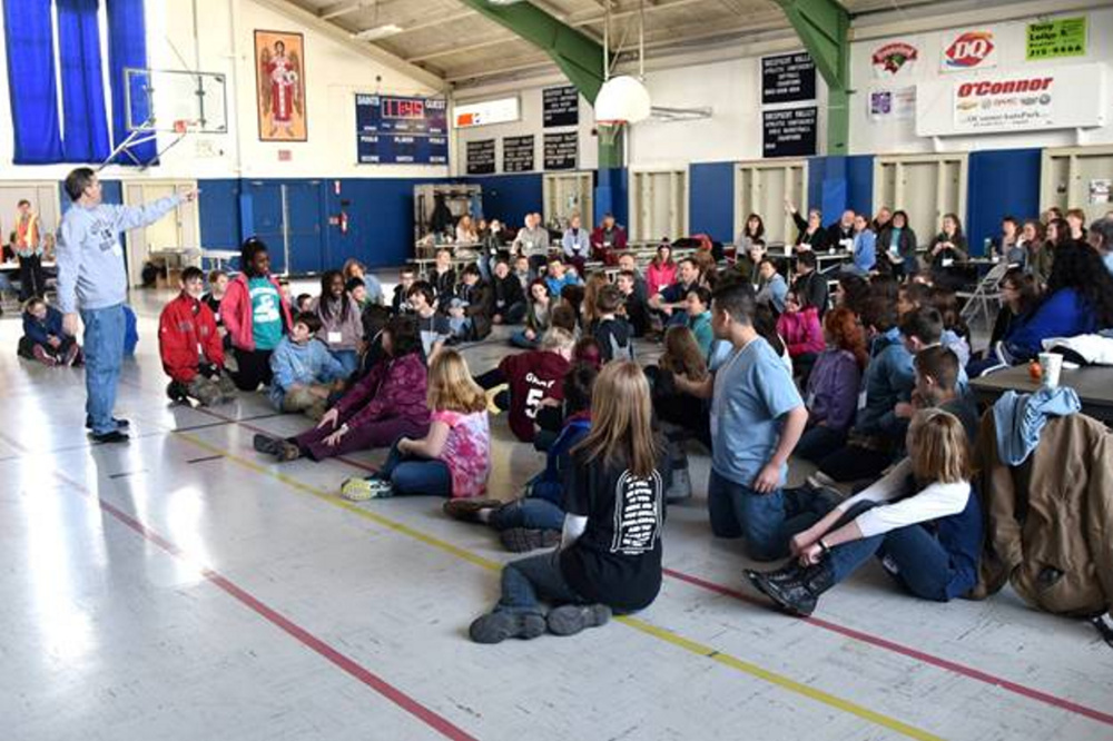 Presenter Mike Patin speaks to more than 130 area teens about the gifts they bring to the church and community during the "Build a Bridge, Love Your Neighbor" middle school rally March 4 at St. Michael School in Augusta.