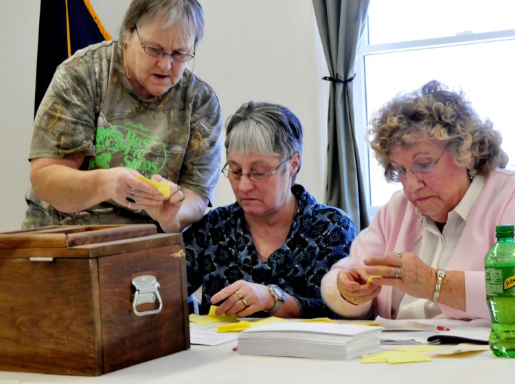 Thorndike ballot clerks Donna Smith, left, Lucille Gardiner and LouAnn Cranouski stayed busy counting ballots during the annual town meeting on Saturday.