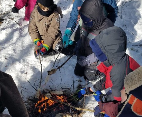 Local first- and second-graders from Juniper Hill School take part in the School in the Woods: Midcoast Conservancy, an outdoor classroom in Alna. A core part of the school's curriculum promotes student interaction with the natural world.
