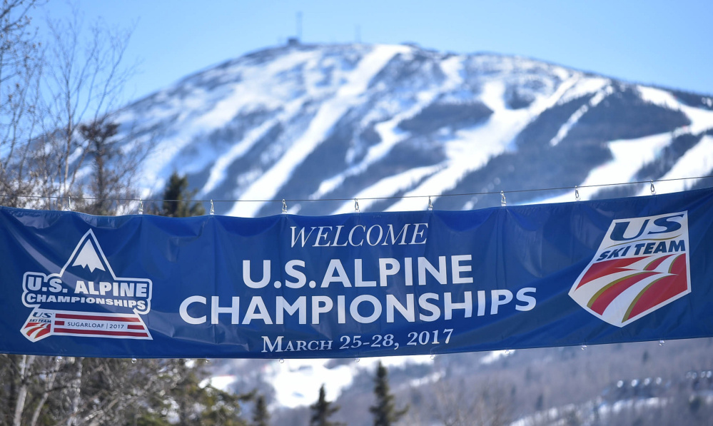 A sign welcoming competitors and visitors to the US Alpine Championships hangs over the entrance to Sugarloaf on Thursday in Carrabassett Valley.