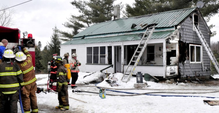 Firefighters from seven area departments went to fight a house fire that destroyed a home Friday on Barker Road in Troy.