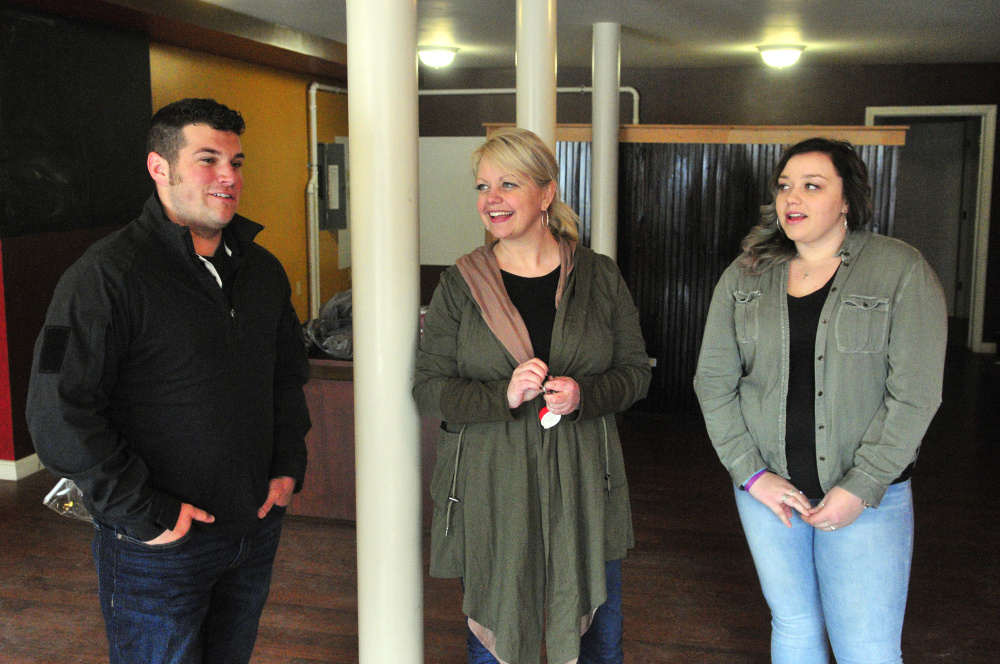 From left, Tyler Arsenault, Kim Stoneton and Haley Stoneton talk about plans for 8's Coffee Bar on Friday in the first floor of a building Kim Stoneton owns at 130 Main St. in downtown Winthrop.