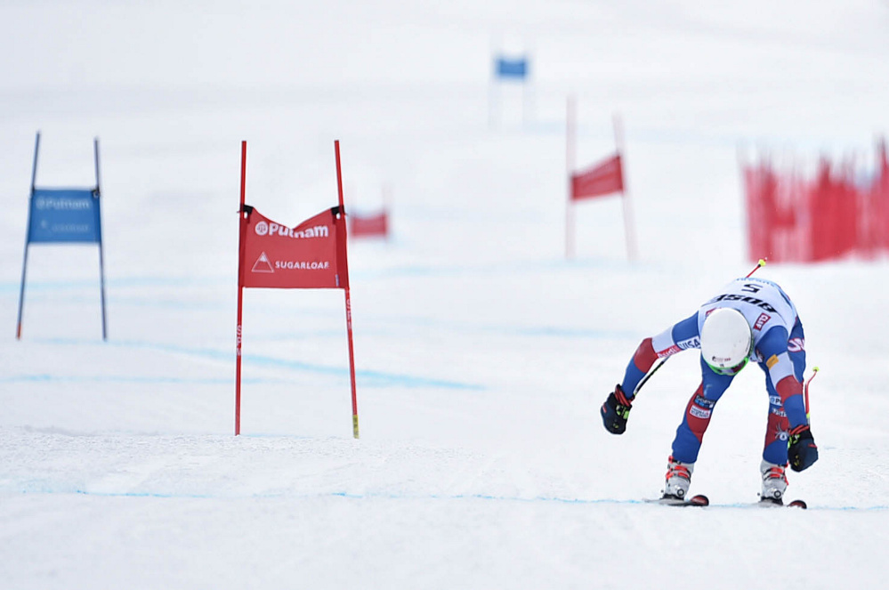 Laurenne Ross reaches for the finish line for the win in the super-G in the U.S. Alpine Championships at Sugarloaf on Saturday in Carrabassett Valley.