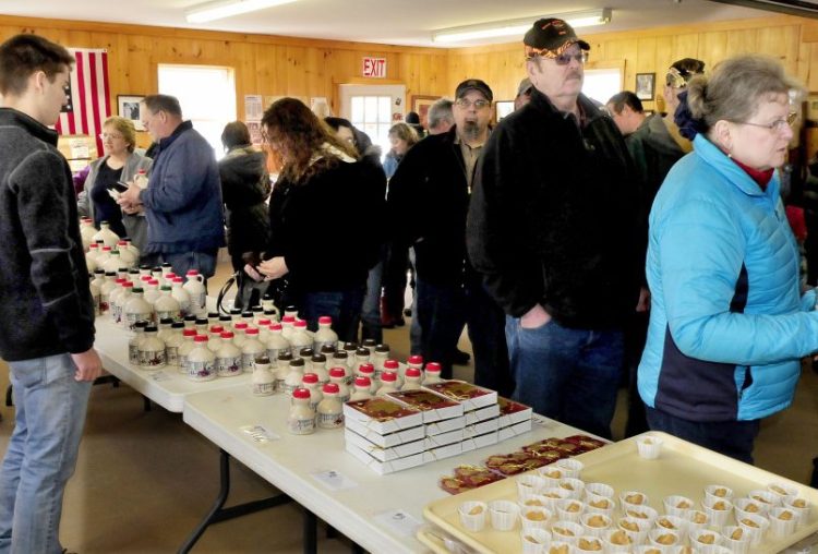 People filled a building at Strawberry Hill Farm in Skowhegan on Maine Maple Sunday to sample and purchase maple products.