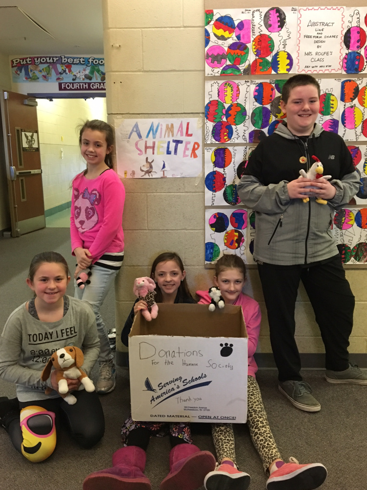 A group of fourth-grade students from Crystal Pomerleau's class with their sign and donation box for the Humane Society Waterville Area. From left are Abby Chartrand, Maya Veilleux, Maya Lavallee, Haidyn Parlin and Hunter Ward.