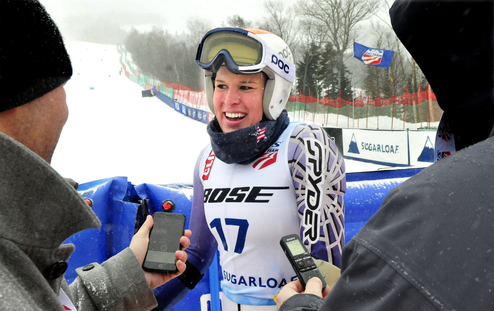 Colby College captain Mardi Haskell speaks with the media after her women's giant slalom run during the U.S. Alpine Championships on Monday at Sugarloaf Mountain.