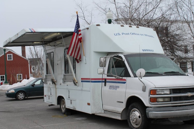 The United States Postal Service has begun offering retail services out of a van temporarily parked near the remains of Winthrop's post office, which was destroyed by a fire in February.