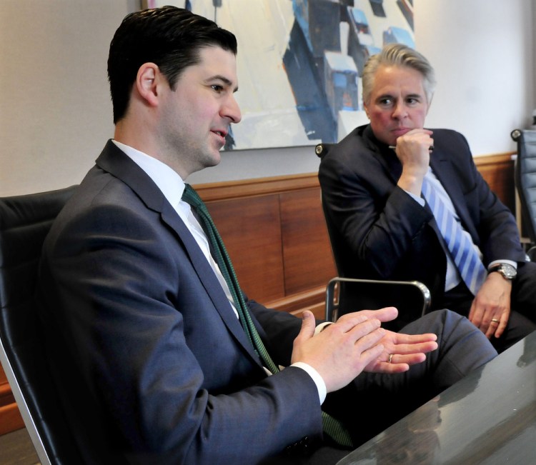 Waterville Mayor Nick Isgro, left, and Colby College President David Greene speak on Wednesday about revitalization plans and development of downtown Waterville.