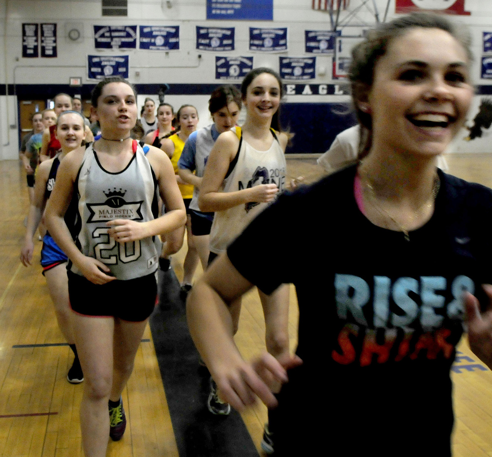 Messalonskee girls lacrosse players run during practice Wednesday at the high school.