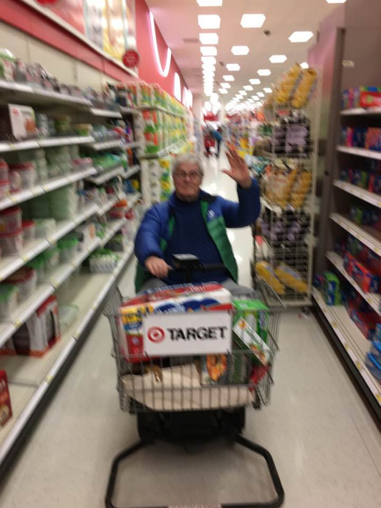 J.P. Devine, seen in his golden electric cart, patrols of aisles at Target.