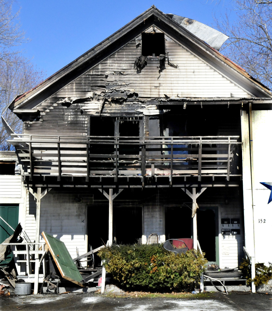 The charred remains of several efficiency apartments were still standing March 5 after fire destroyed part of the building at 152 Main St. in Madison. The Office of State Fire Marshal has determined a human element caused the fire.