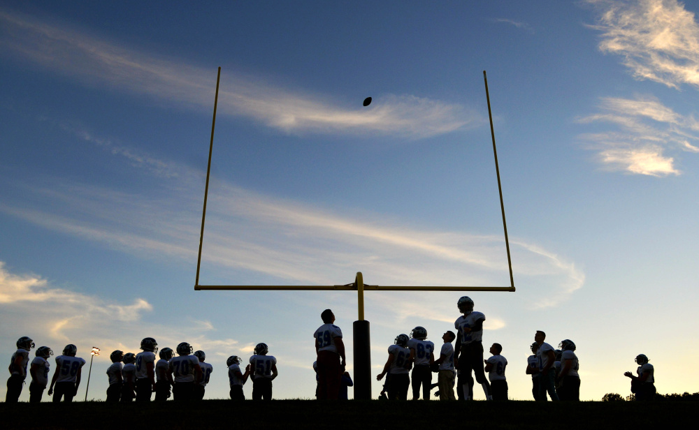 Players get ready before the start of the Lawrence-Mt. Blue football game last season.