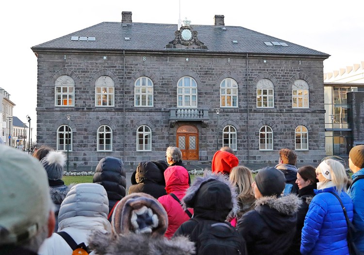 A crowd forms in front of the Icelandic parliament, the Althing, in Reykjavik last October, when thousands of Icelandic women left work at 2:38 p.m. and demonstrated outside parliament to protest the gender pay gap.
