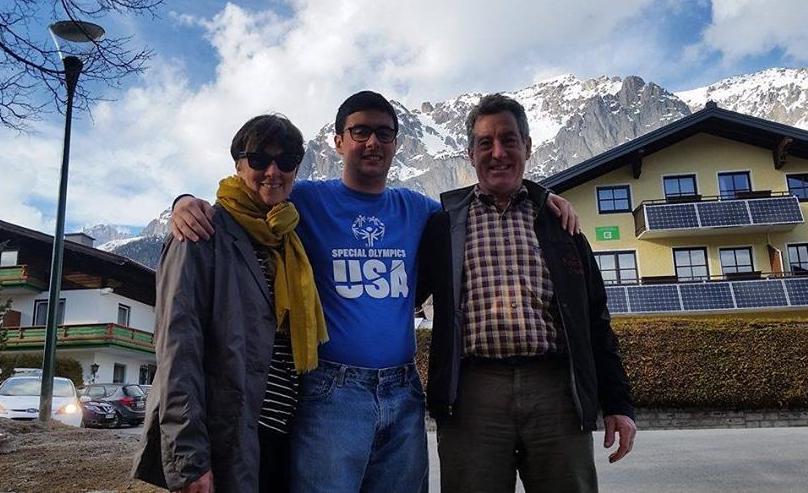 Lucas Houk poses for a photo with his parents after their arrival in Austria on March 14.