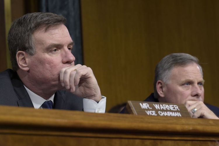 Senate Select Committee on Intelligence Chairman Sen. Richard Burr, R-N.C., right, and Vice Chairman Sen. Mark Warner, D-Va., listen to testimony during a  hearing on Capitol Hill Thursday  on Russian intelligence activities. 