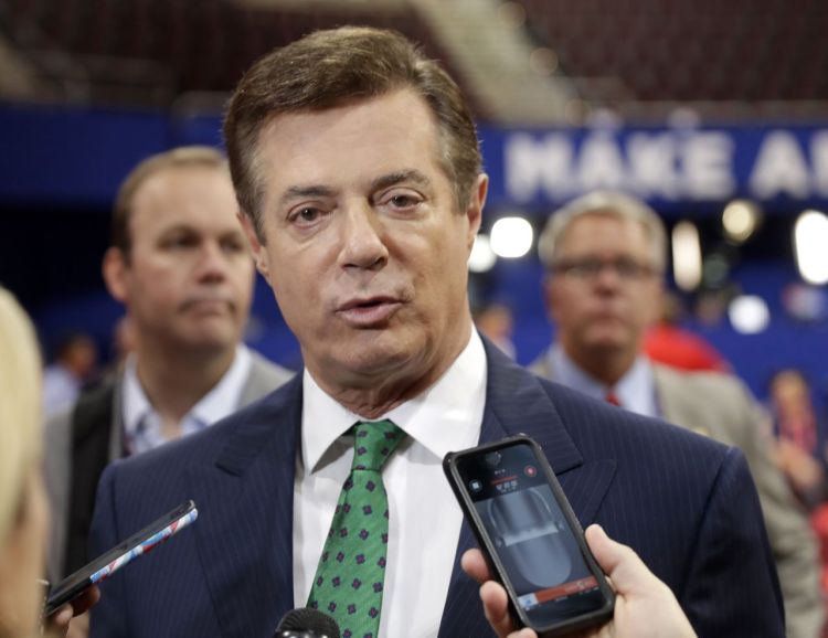 Paul Manafort talks to reporters on the floor of the Republican National Convention in Cleveland on July 17, 2016. Manafort worked as Trump's unpaid campaign chairman last year from March until August. Trump asked him to resign after it was revealed that Manafort had orchestrated a covert Washington lobbying operation until 2014 on behalf of Ukraine's ruling pro-Russian political party.