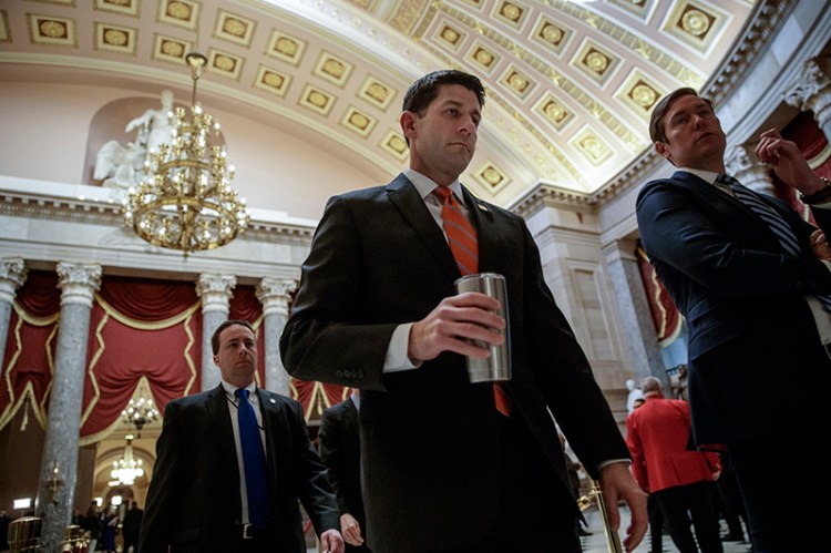 House Speaker Paul Ryan of Wis. walks to his office  on Thursday as he and the Republican leadership scramble for votes on their health care overhaul.