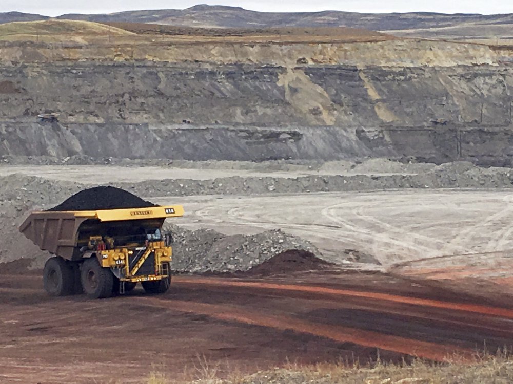 A dump truck the size of a house hauls coal at Contura Energy's Eagle Butte Mine near Gillette, Wyo., where President Trump's lifting of a federal coal-lease moratorium will allow new coal leasing to resume at the open pits in the Powder River Basin.
