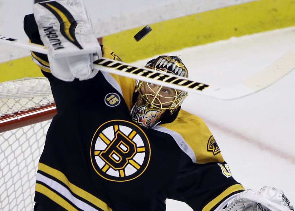 Bruins goalie Tuukka Rask makes a stick save during the first period Thursday night against the Ottawa Senators in Boston.