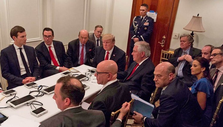 President Trump and his national security team are briefed via videoconference by Gen. Joseph Dunford, chairman of the Joint Chiefs of Staff, on the missile strike on Syria. The meeting was held in the Sensitive Compartmented Information Facility at Trump's Mar-a-Lago resort in Florida. White House Press Secretary Sean Spicer said the image was digitally edited for security purposes.