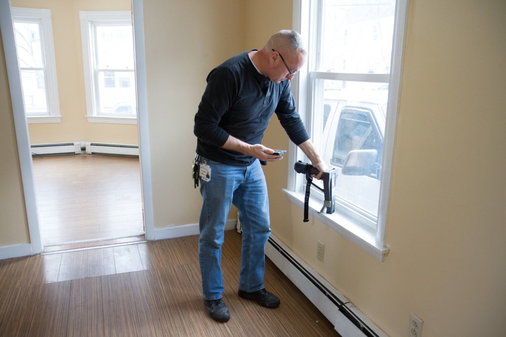 Robert Martel of Community Concepts Housing and Energy Services conducts a lead inspection at an apartment on Howe Street in Lewiston. Kids in Lewiston-Auburn get lead poisoning at three times the rate of the rest of the state.