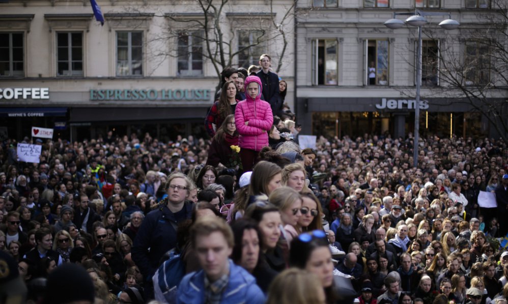 Thousands of people attend a "Lovefest" vigil against terrorism in Sergels Torg, central Stockholm, on Sunday. A hijacked truck was driven into a crowd of pedestrians and crashed into a department store Friday in the Swedish capital.