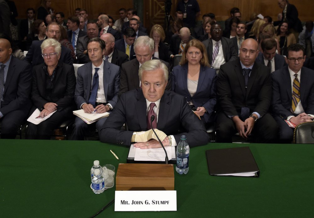 Wells Fargo's then-CEO John Stumpf testifies before the Senate Banking Committee last September about fake accounts created by bank employees to meet sales goals. Stumpf was an optimist "who refused to believe that the sales model was seriously impaired," a directors' report says.