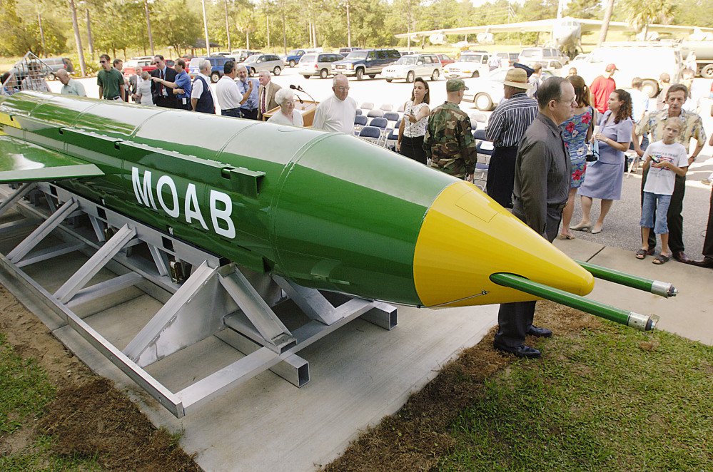 In this May 2004 photo, a group gathers around a GBU-43B, or massive ordnance air blast, bomb at the Air Force Armament Museum on Eglin Air Force Base near Valparaiso, Florida. U.S. forces in Afghanistan struck an Islamic State tunnel complex in eastern Afghanistan with the bomb on Thursday.