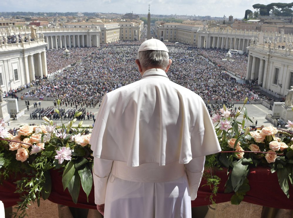 Pope Francis addresses a crowd of 60,000 before delivering his Urbi et Orbi (to the city and to the world) message from St. Peter's Basilica at the Vatican on Sunday.