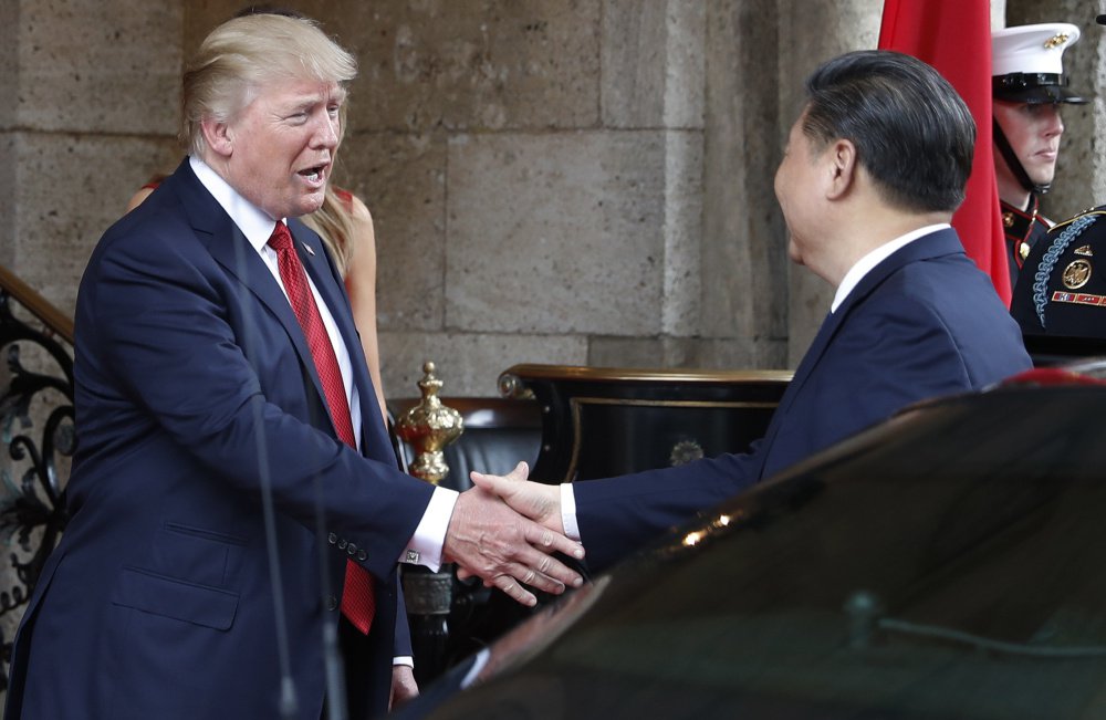President Trump greets Chinese President Xi Jinping at Mar-a-Lago resort, in Palm Beach, Fla., on April 6. On Thursday, he hailed the Chinese leader as "a terrific person" and "a very special man." Once soft on Russia and hard on China, Trump is changing his views on these world powers.