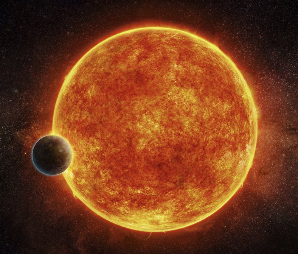 This artist's rendering depicts LHS 1140b, a newly discovered rocky planet in the habitable zone for life, surrounding its small, faint red host star.