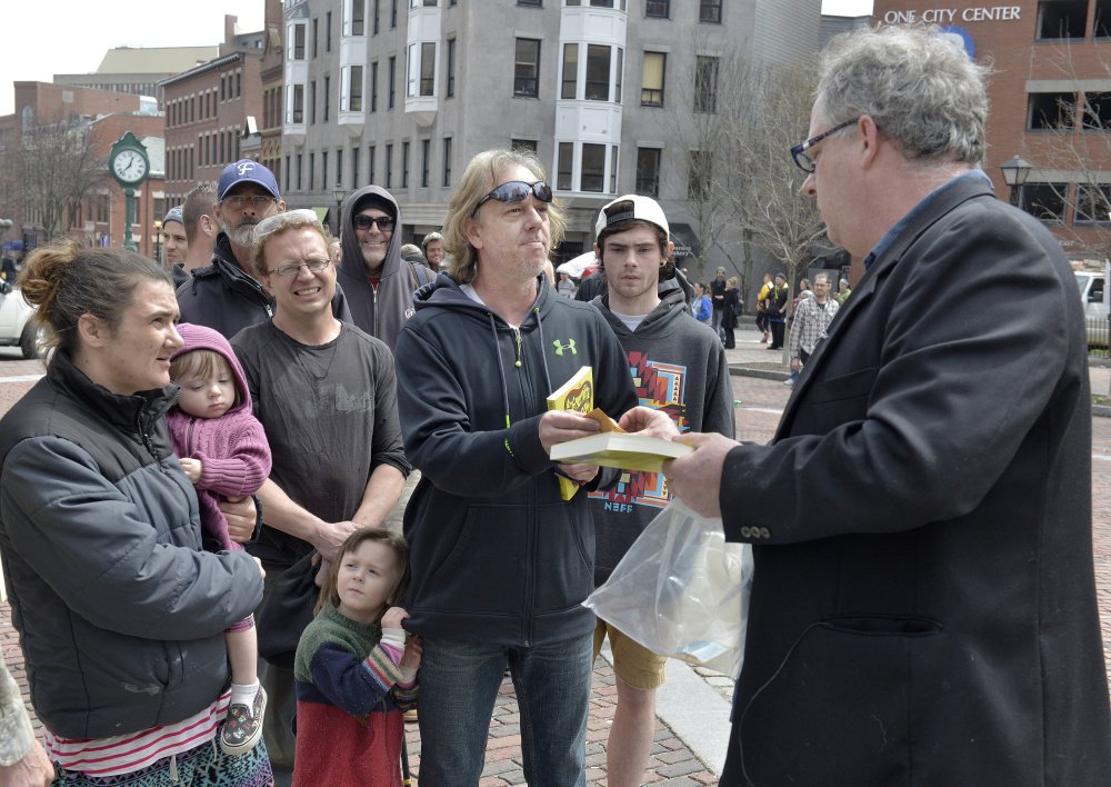 Crash Barry attracts fans with his 1-gram pot packets on April 20, including Victor Smith of Westbrook. "Happy holidays," Barry told the crowd. "Happy 4/20."