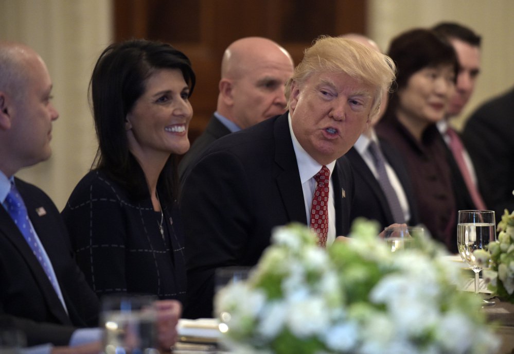 President Trump, sitting next to U.S. Ambassador to the U.N. Nikki Haley, attends a working lunch with ambassadors of countries on the United Nations Security Council and their spouses at the White House on Monday.