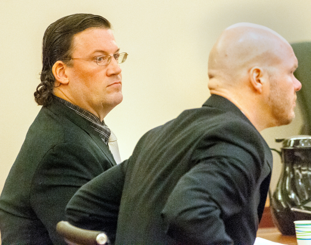 Michael Hein, left, and his attorney Scott Hess appear in court March 3 in the Capital Judicial Center in Augusta, where Hein was acquitted of a charge of animal cruelty.
