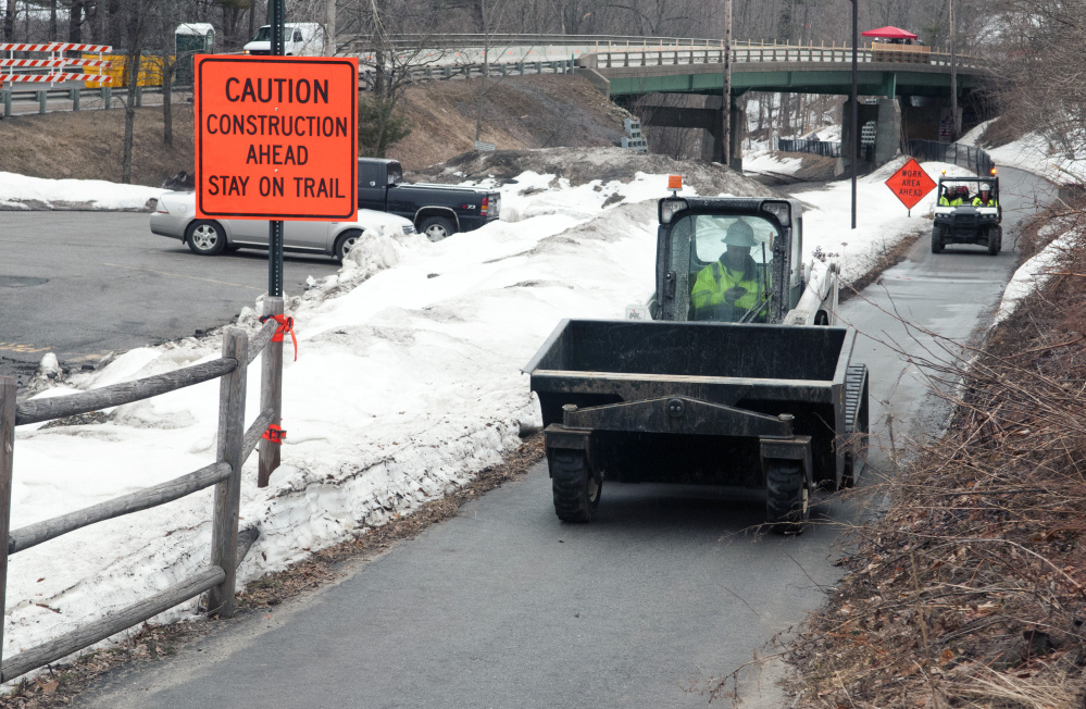 Work is going on above and below Water Street, as seen from the Kennebec River Rail Trail on Tuesday, at Millikens Crossing Bridge in Hallowell.