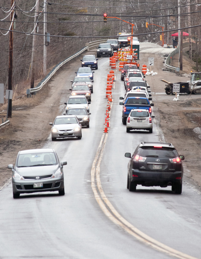 Traffic on Water Street backs up because of alternating traffic in just one lane Tuesday at Millikens Crossing Bridge in Hallowell.