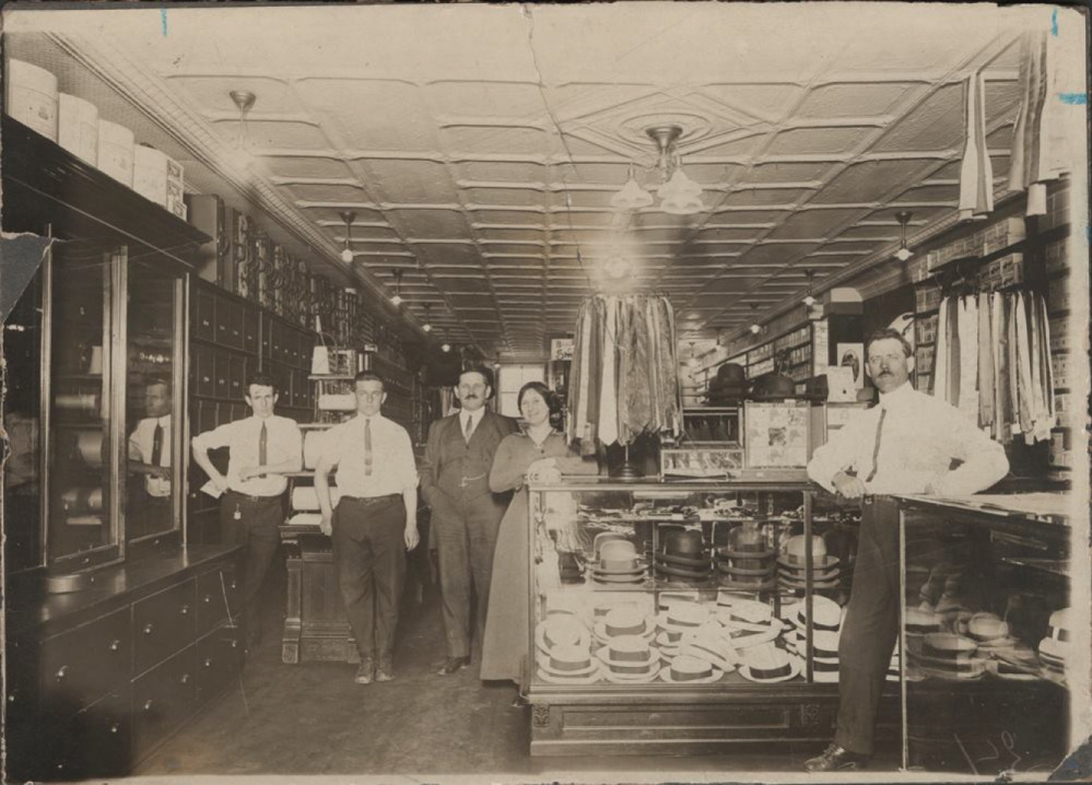 The interior of Levine's store with William Levine and store personnel, albumen print, 1908. The photo is part of the Levine Family Photograph Collection at Colby libraries.