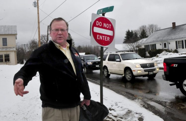Skowhegan Road Commissioner Greg Dore stands Wednesday at the intersection of Gem Street and North Avenue in Skowhegan, where Gem Street will become a one-way road on April 17. The change is a result of congestion on the two-way street and complaints from residents.