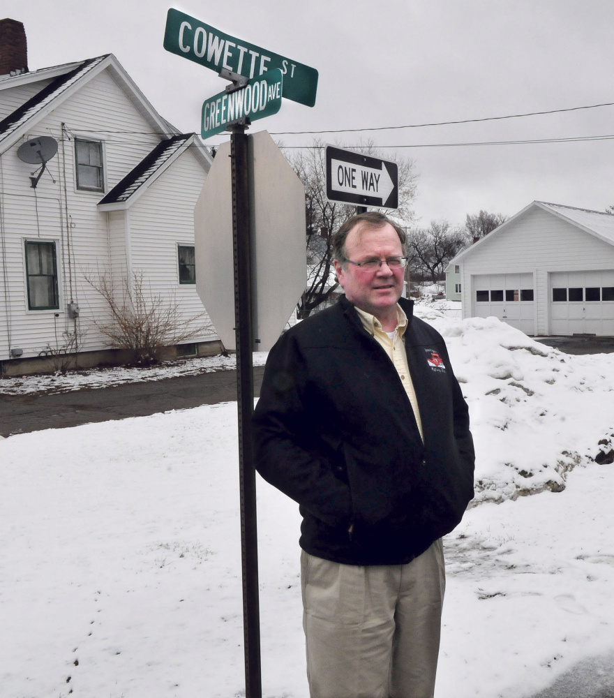 Skowhegan Road Commissioner Greg Dore stands Wednesday at the intersection of Cowette and Greenwood Streets in Skowhegan. Cowette and nearby Gem Street will become a one-way street on April 17. The change is a result of congestion on the two-way street and complaints from residents.