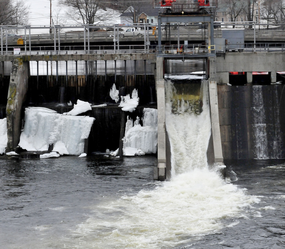 Water flows out of the Weston Dam on Thursday in Skowhegan as ice covers other sections of the Kennebec River. The River Flow Advisory Commission met Thursday to discuss river ice and flood risks for this spring. It predicted no danger of severe flooding.
