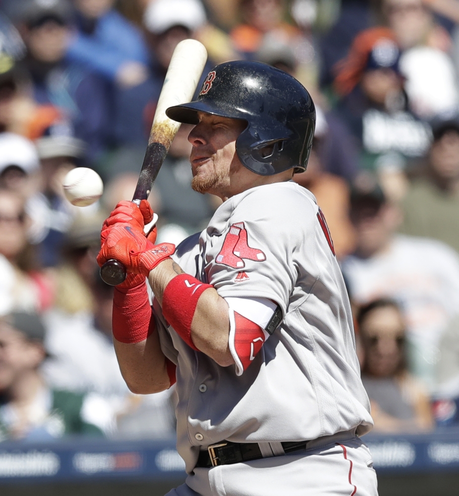 Boston catcher Christian Vazquez is hit by a pitch during the fifth inning Saturday against the Detroit Tigers.