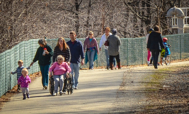 Dozens of people mobbed the Kennebec River Rail Trail in Augusta on Sunday as temperatures warmed up and the sun came out.