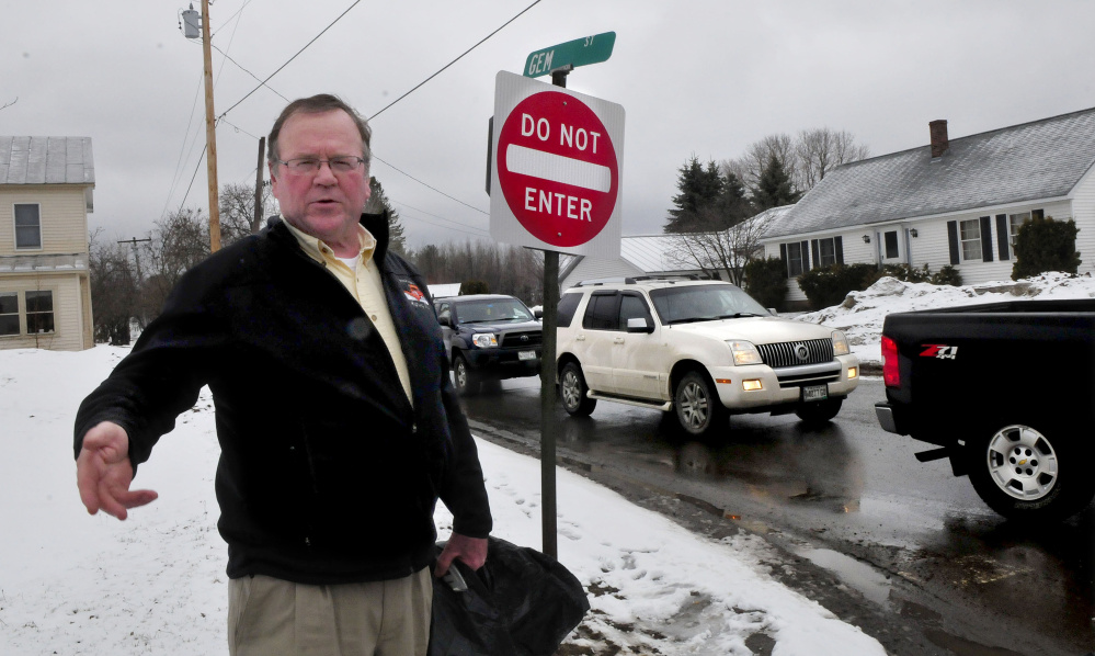 Skowhegan Road Commissioner Greg Dore stands at the intersection of Gem Street and North Avenue in Skowhegan, where Gem Street will become a one-way road on April 17.